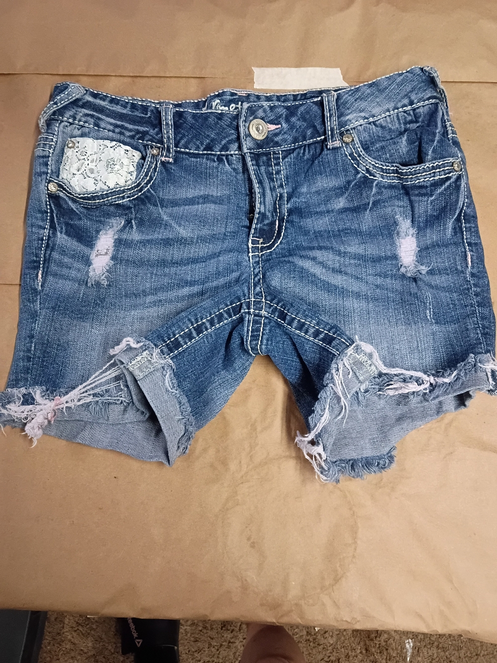 Women’s Distressed Blue Denim Shorts with Lace Pocket